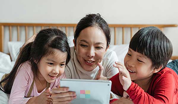 Mother and children happy, working together